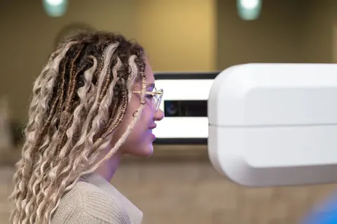 A patient being measured on the Zeiss Visufit 1000