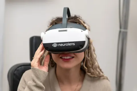 A patient wearing the Neurolens measurement headset