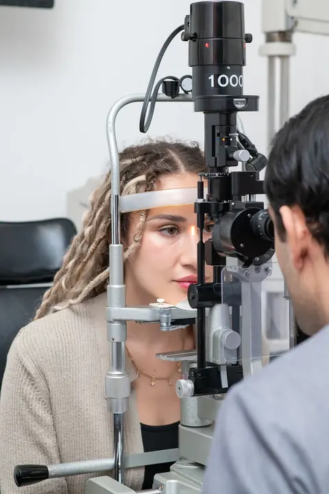 A patient being examined at the slit lamp