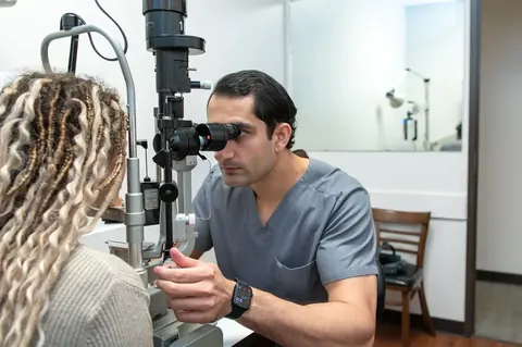 Dr. Waqar performing a slit lamp examination
